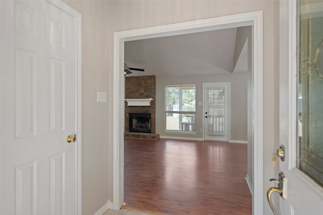 interior space featuring hardwood / wood-style floors, a fireplace, and ceiling fan