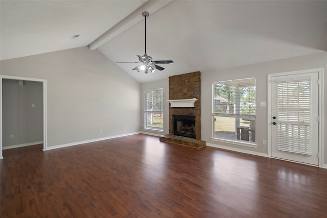 unfurnished living room with ceiling fan, a fireplace, beamed ceiling, and dark hardwood / wood-style floors