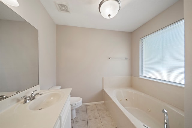 bathroom featuring a bathtub, toilet, tile patterned floors, and vanity