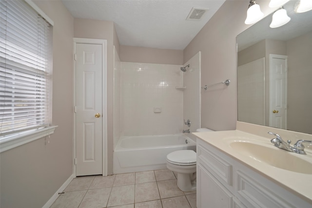 full bathroom with a textured ceiling, toilet, tile patterned floors, vanity, and tiled shower / bath combo