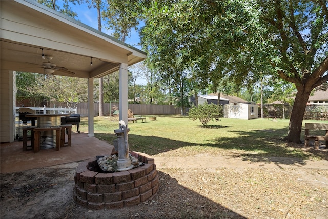 view of yard with a patio area and ceiling fan