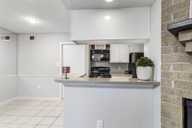 kitchen with black appliances, kitchen peninsula, a textured ceiling, light tile patterned flooring, and white cabinetry