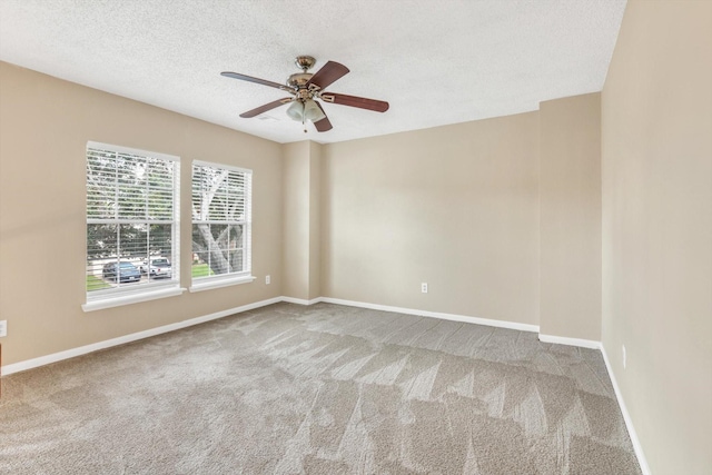 5635 Sage Manor Dr, Houston, TX 77084 - unfurnished room featuring baseboards, ceiling fan, carpet floors, and a textured ceiling