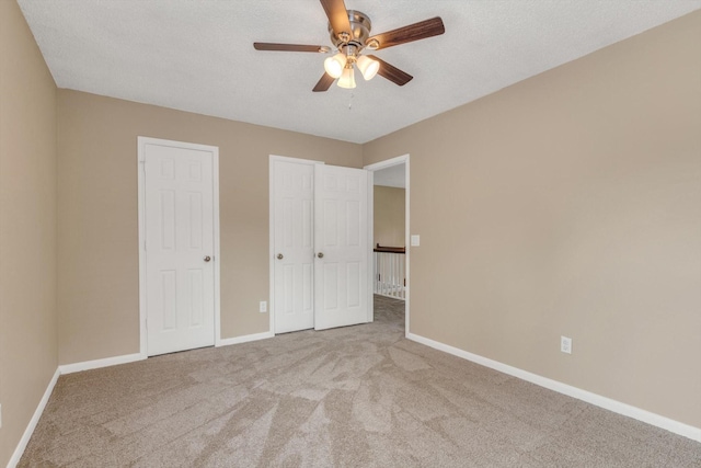 5635 Sage Manor Dr, Houston, TX 77084 - unfurnished bedroom with multiple closets, baseboards, and carpet floors