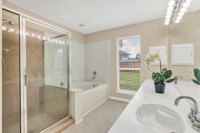 5635 Sage Manor Dr, Houston, TX 77084 - full bath with tile patterned floors, a garden tub, a shower stall, and a sink