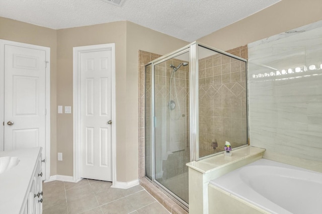 5635 Sage Manor Dr, Houston, TX 77084 - full bath featuring tile patterned floors, a bath, vanity, baseboards, and a stall shower