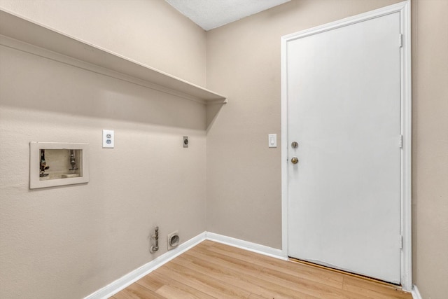 5635 Sage Manor Dr, Houston, TX 77084 - washroom with washer hookup, laundry area, light wood-type flooring, electric dryer hookup, and baseboards