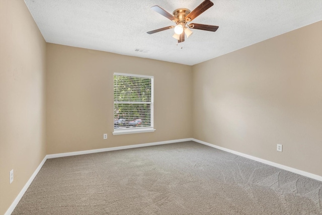 5635 Sage Manor Dr, Houston, TX 77084 - unfurnished room with ceiling fan, visible vents, carpet, baseboards, and a textured ceiling