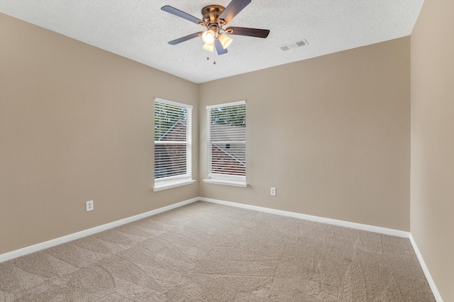 5635 Sage Manor Dr, Houston, TX 77084 - carpeted empty room featuring a textured ceiling, visible vents, ceiling fan, and baseboards