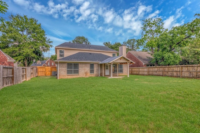 5635 Sage Manor Dr, Houston, TX 77084 - rear view of property with a patio area, a chimney, a fenced backyard, a lawn, and brick siding