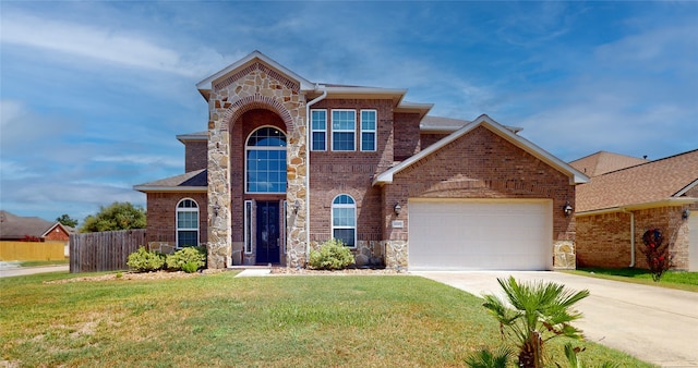 front facade featuring a garage and a front lawn