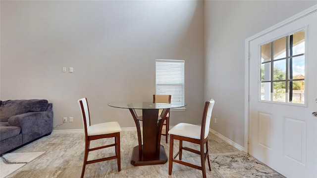 dining space with light hardwood / wood-style flooring