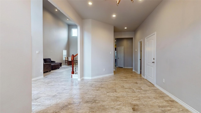 hallway featuring light tile patterned floors