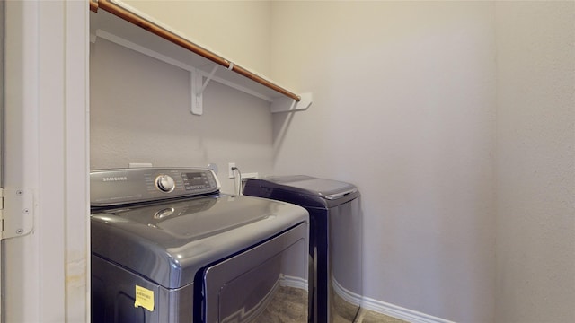 laundry room with independent washer and dryer