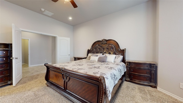 bedroom featuring light carpet and ceiling fan