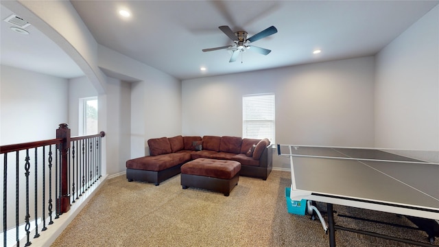 rec room featuring carpet and ceiling fan