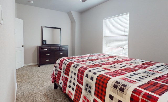 bedroom with light colored carpet