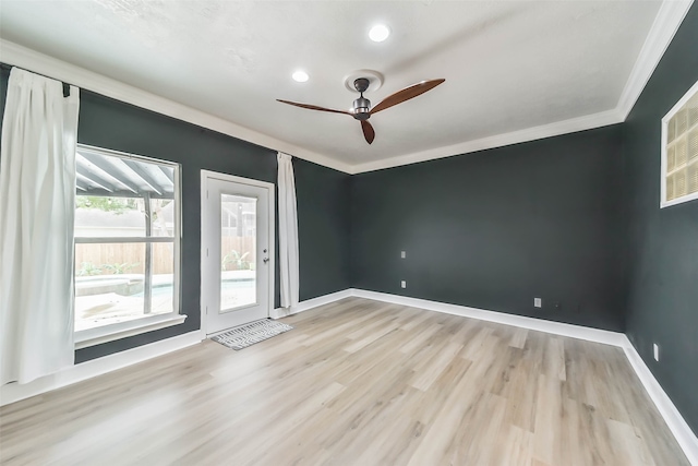 spare room featuring ornamental molding, hardwood / wood-style floors, and ceiling fan