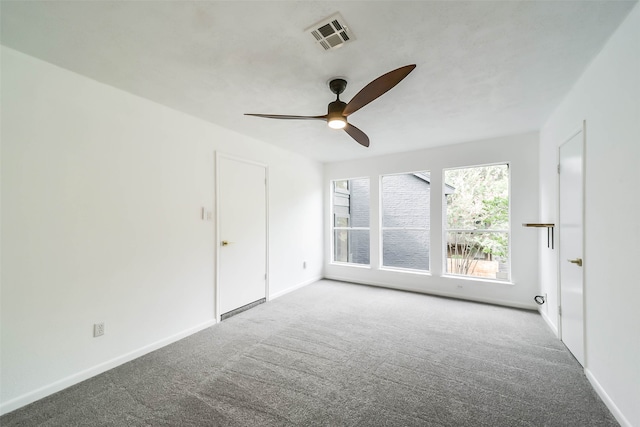 carpeted empty room with ceiling fan