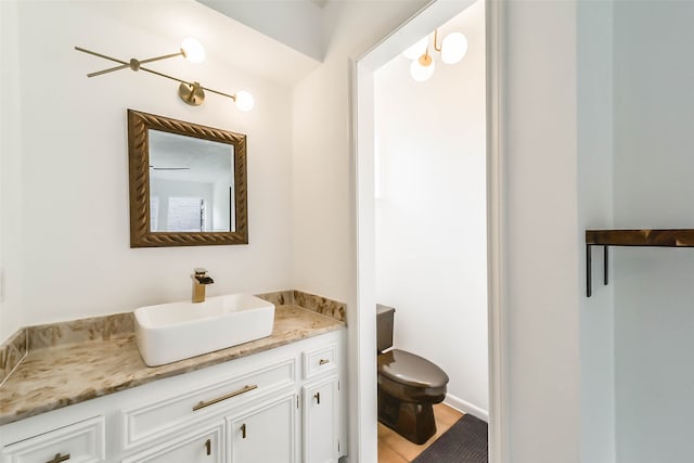 bathroom with vanity, toilet, and tile patterned floors