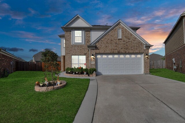 18306 Fresh Air Ct, Houston, TX 77084 - traditional-style home with concrete driveway, brick siding, and fence