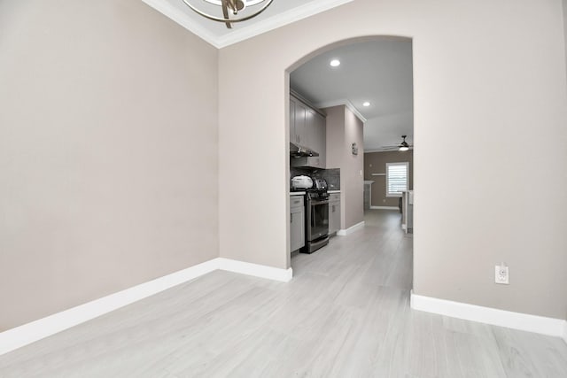18306 Fresh Air Ct, Houston, TX 77084 - empty room with arched walkways, baseboards, ornamental molding, recessed lighting, and light wood-style flooring