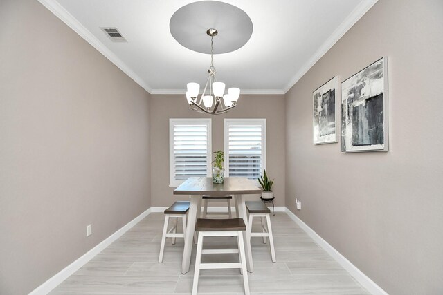 18306 Fresh Air Ct, Houston, TX 77084 - dining room featuring visible vents, baseboards, crown molding, and an inviting chandelier