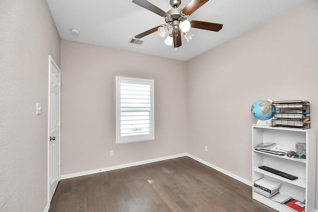 18306 Fresh Air Ct, Houston, TX 77084 - unfurnished room with visible vents, a ceiling fan, baseboards, and dark wood finished floors