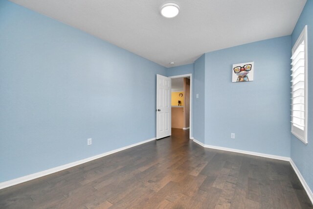 18306 Fresh Air Ct, Houston, TX 77084 - spare room with baseboards, plenty of natural light, and dark wood finished floors