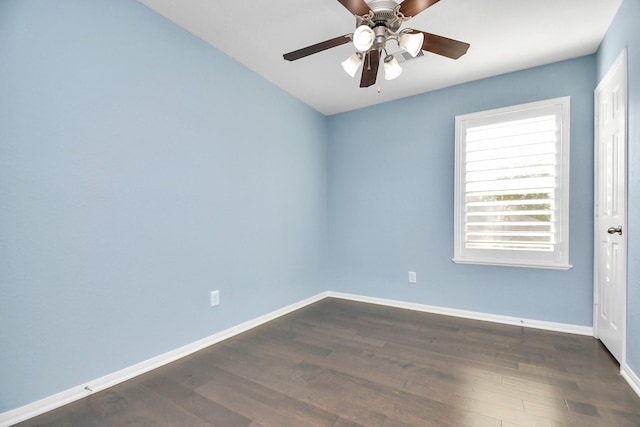 18306 Fresh Air Ct, Houston, TX 77084 - unfurnished room featuring baseboards, a ceiling fan, and dark wood-style floors