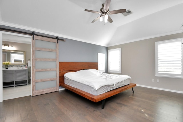18306 Fresh Air Ct, Houston, TX 77084 - bedroom featuring visible vents, a barn door, dark wood-type flooring, and vaulted ceiling
