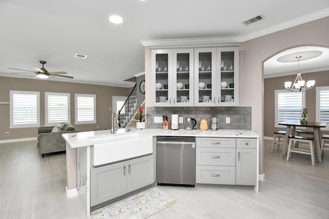 18306 Fresh Air Ct, Houston, TX 77084 - kitchen featuring a sink, crown molding, visible vents, and dishwasher