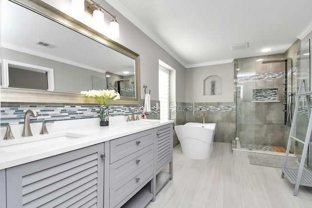 18306 Fresh Air Ct, Houston, TX 77084 - full bathroom featuring a sink, tile walls, a stall shower, and visible vents