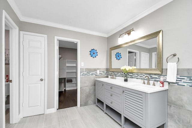 18306 Fresh Air Ct, Houston, TX 77084 - full bath with crown molding, a sink, double vanity, and tile walls