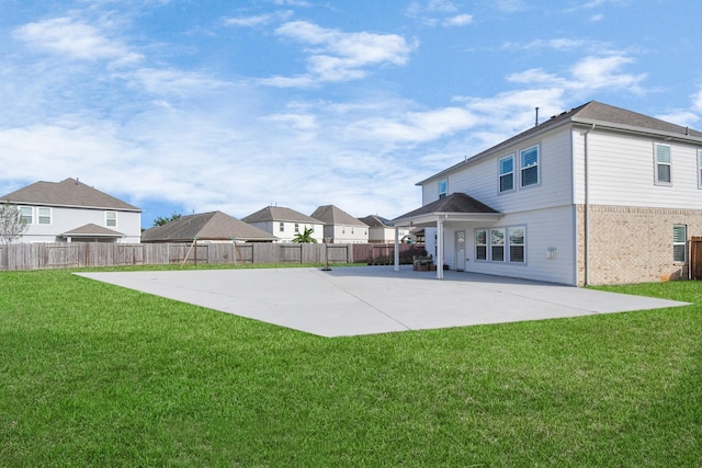 18306 Fresh Air Ct, Houston, TX 77084 - rear view of house featuring a lawn, fence, a patio area, and brick siding