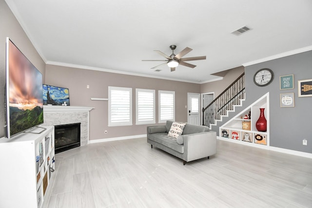 18306 Fresh Air Ct, Houston, TX 77084 - living room featuring ceiling fan, visible vents, baseboards, and a high end fireplace