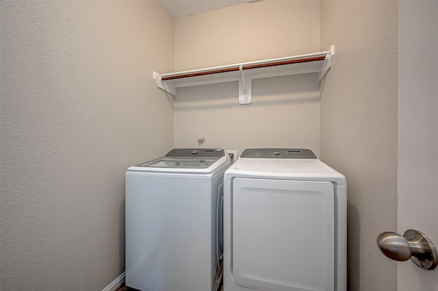 laundry room with independent washer and dryer