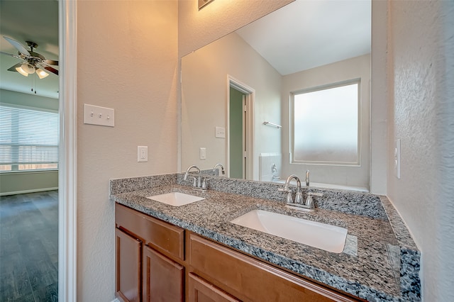 bathroom with vanity, hardwood / wood-style flooring, and ceiling fan