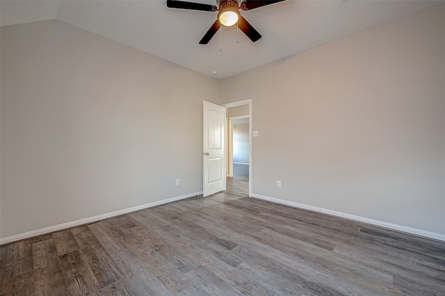 unfurnished room featuring lofted ceiling, wood-type flooring, and ceiling fan