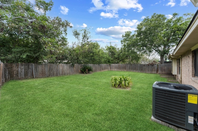 view of yard featuring central air condition unit