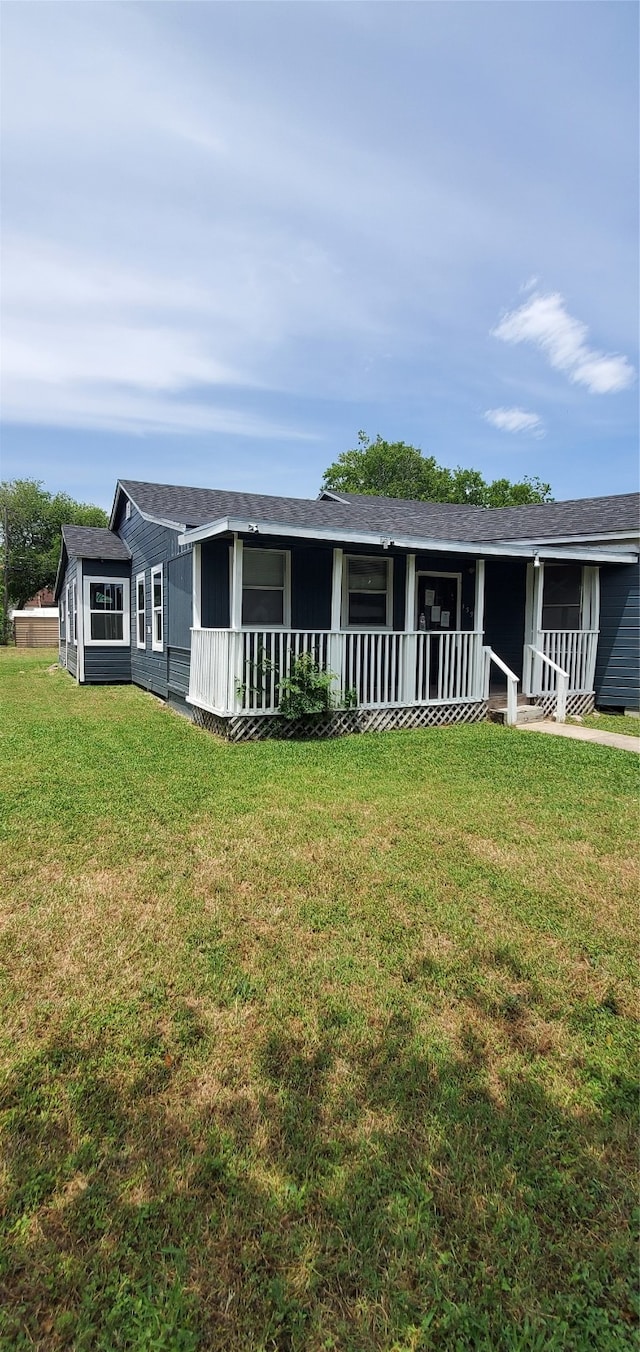 ranch-style home with a front lawn