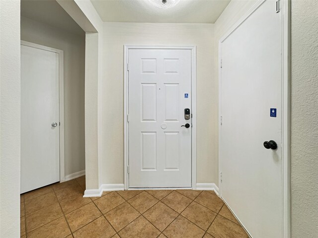 foyer featuring light tile patterned floors