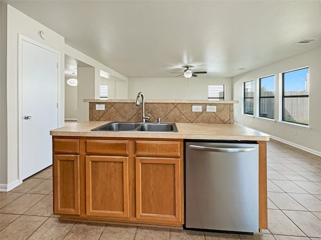 kitchen featuring stainless steel dishwasher, ceiling fan, light tile patterned floors, and tasteful backsplash