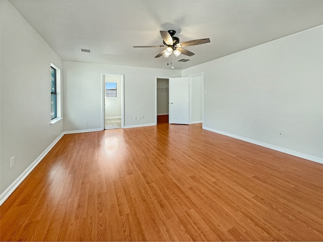 interior space with light wood-type flooring and ceiling fan