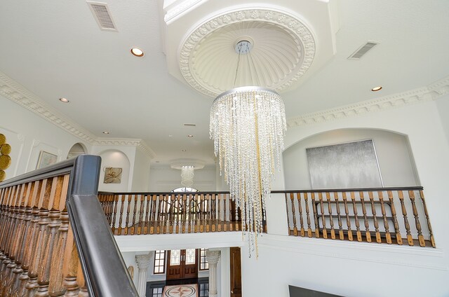 interior space with a high ceiling and a notable chandelier