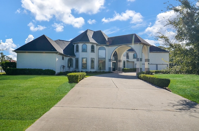 french country style house with a front yard