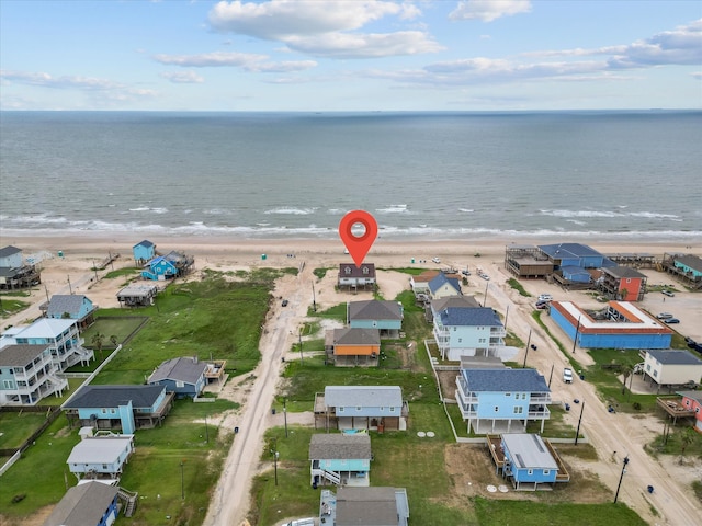 bird's eye view with a water view and a view of the beach