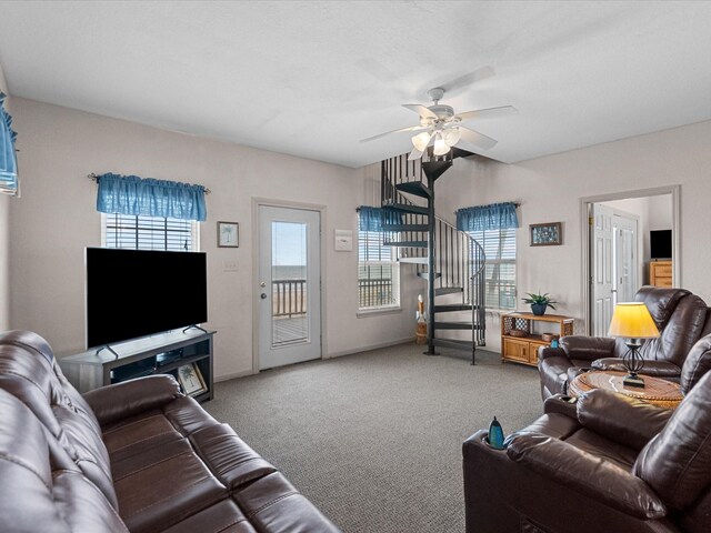 125 Driftwood Ct, Surfside Beach, TX 77541 - living room with carpet flooring, a ceiling fan, baseboards, and a healthy amount of sunlight
