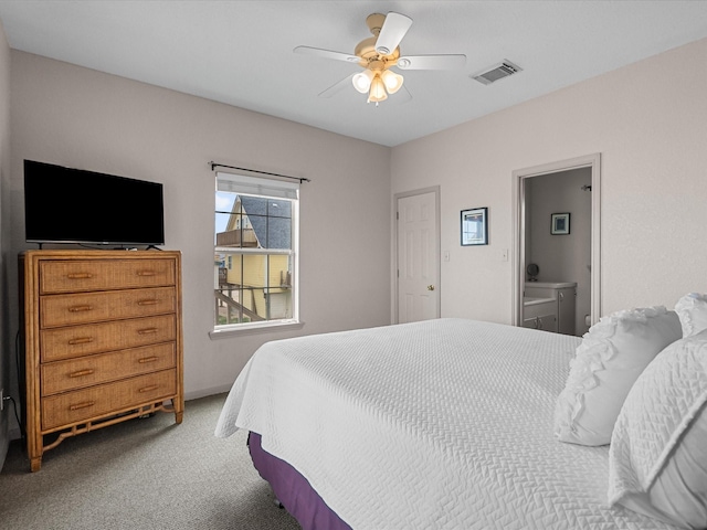 125 Driftwood Ct, Surfside Beach, TX 77541 - bedroom with ceiling fan, carpet flooring, ensuite bath, and visible vents
