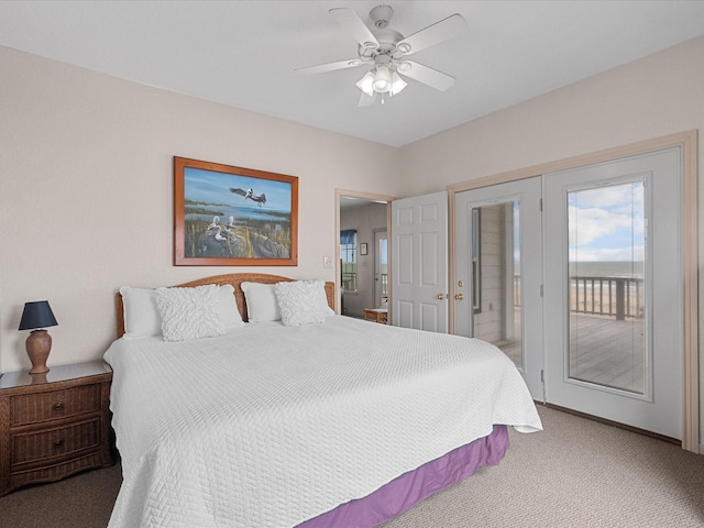 carpeted bedroom featuring ceiling fan and access to outside